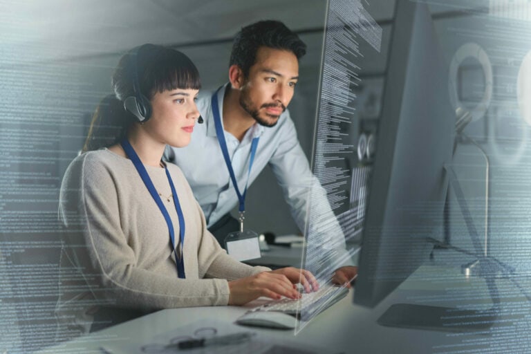 Woman and Man working on laptop