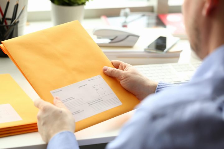 Postage meter and outgoing mail in an office mailroom