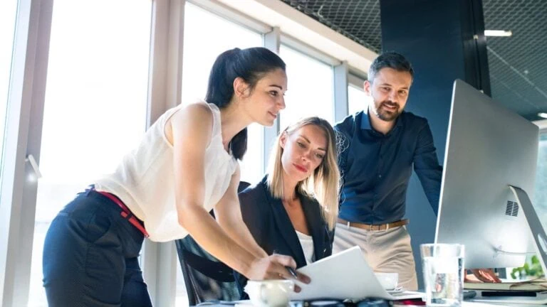 Nonprofit staff using secure technology solutions and managed IT services to improve productivity while reducing operational costs.