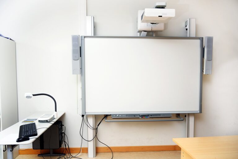 Students entering a modern school equipped with upgraded security systems, classroom technology, and managed IT infrastructure.